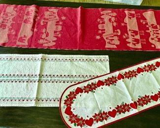 Variety of Swedish Christmas table linens. 

The red rectangle runner is by Ekelund and measures 51.5” x 15” 
The rounded corners heart motif runner is by Stilduk and measures 32.5” x 11” 
The rectangle shaped runner with heart design is by Odin and measures 15” x 13.5” 
Four cloth napkins which contain some light stains. 
