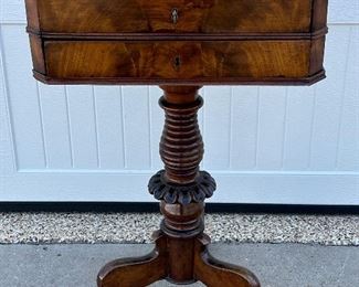 Antique mahogany work table or petite desk. A wonderful size beautiful antique table with a gorgeous finish. Features two drawers with keys.  In overall good condition with wear consistent with age. Measures 18.5” x 16” x 29.5” 