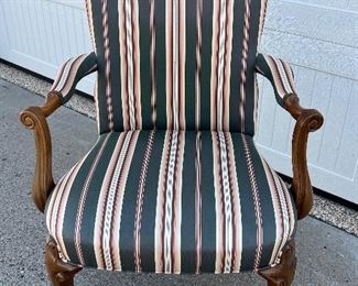 Vintage Upholstered Wood Framed Chair in very good condition. Upholstered in a lovely multi colored striped fabric that would easily match a variety of home decors. Measures arm to arm 26” and an overall height of 40” 