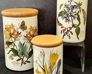 Three Piece Portmeirion Botanic Gardens Canister Set. In very good condition with light wear to the wooden lids and measuring 8.5", 7" and 5.5"