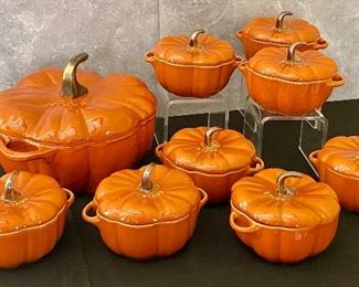 Staub Cast Iron Pumpkin Covered Dish and Eight Ceramic Staub pumpkin covered dishes. 