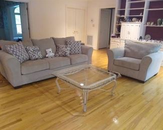 Almost NEW sofa and loveseat set with pillows. Glass and iron coffee table. 
