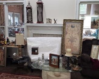 Household decor, coffee table, white leather loveseat, rugs, lamps, artwork