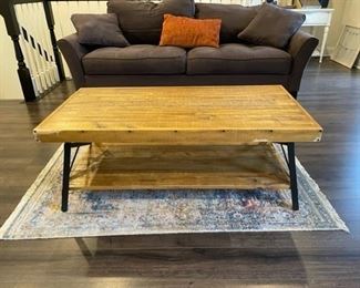 $50 - Faux Wood Coffee Table JR93-25                                      This industrial styled coffee table afford great upper and lower storage surfaces.                                                                              Chipped or chewed damage on two corners and side  48" x 24" x 18"H