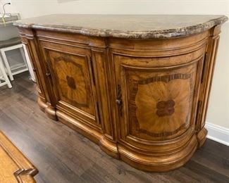 $600 - Thomasville Furniture Tuscan Hills Bibbiano Sideboard
Bibbiano, Italy, boasts vineyards, wineries and a 1,000-year-old castle. With exotic wood inlays and a Dark Emperador marble top, the Bibbiano Sideboard makes an equally impressive statement in your dining room—and serves you royally. Behind the rounded end doors is a single adjustable shelf. The center section includes a tray drawer with silver divider and an adjustable shelf.  79" x 26" x 39H"