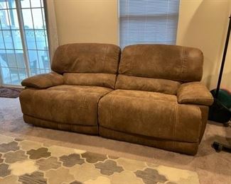 $250 - Faux Suede Brown Reclining 2 Seater Couch JR93-4                                                                                                       Stylish and durable, this classic sofa looks great in a traditional space. Plush cushions on the seat and back offer head and lumbar support while remaining classy.  82" x 44" x 37"H