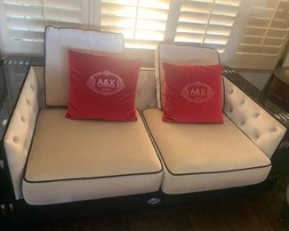 $2999Featuring the A&X Collections signature laser-cut crocodile textured pattern, the Bellagio loveseat is further enhanced with a glossy black lacquer finish. Faux cow horn inlay embellish the top corners of the loveseat. The cushions are constructed with a soft beige velour fabric and accented with black piping. Inner sides are tufted with crystals to complete this elegant creation. 
W68" x D37" x H24"
Shipping Available 
Excellent Condition   