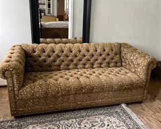 Green tufted sofa