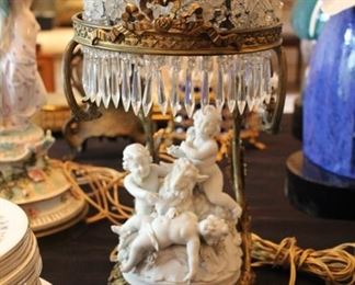 Antique bisque cherub lamp with glass flower shade