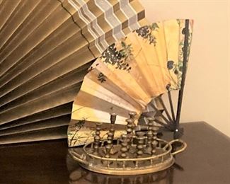 Small fan, small brass candlesticks, and tray
