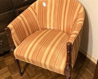 Curved back upholstered chair