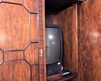 While viewing the TV, the doors slide within the cabinet.