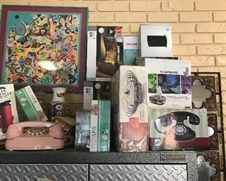 Lots on new in box items such as phones, can openers, pressure cooker, ice cube maker, throws, etc 