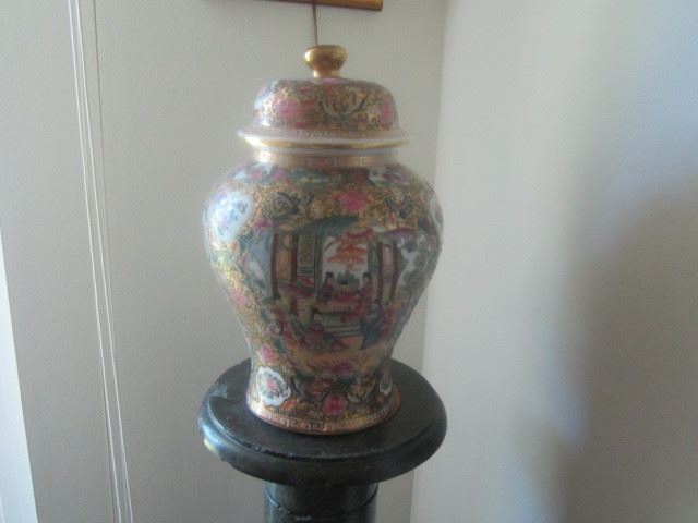 Asian urn on marble pedestal