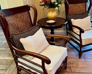 Pair of British Colonial style wing chairs.