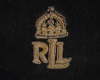 Lot  8766. $30.00. Ralph Lauren Velvet Pillow with Gold Cording around Rim.  RLL Crest in Center of Pillow 	17" W x 17" T x 5 " D. Embroidered Emblem