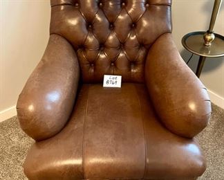 Lot 8769. $1195.00 This is one of the nicest leather chairs we have seen.  Buttery Soft premium Tufted Leather Chair with nail head trim made by Hancock & Moore.Check out the Brass Casters on the front legs and the absolutely beautiful condition,  36" T in Back, 24" D and 29" W Seat