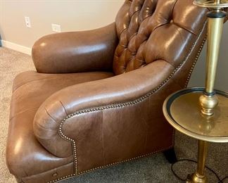 Lot 8769. $1195.00 This is one of the nicest leather chairs we have seen.  Buttery Soft premium Tufted Leather Chair with nail head trim made by Hancock & Moore.Check out the Brass Casters on the front legs and the absolutely beautiful condition,  36" T in Back, 24" D and 29" W Seat