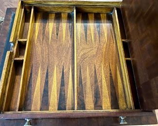 Lot 8778. $750.00  Very Rare Ellis Line by Sligh Game Table in Mahogany with Leather Top. The Drawer pulls out to reveal the Chess and Backgammon Game Boards. Hidden Storage for Chess and Backgammon Pieces (Not Included) pull up for storage.