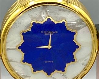Lot 8800. $650.00 Beautiful C.D. Peacock Table Quartx Clock (3.5" Diam) with Pink Marble Columns with Gold Tone Accents, Art Deco Style.  Mother of Pearl Clock Face with 2 Clocks, one with Blue Lapis and Black Obsidian Face.  Retail $1,250.00 signed C.D. Peacock since 1837.  7.5' W x 7" T x 3." D