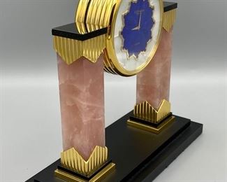 Lot 8800. $650.00 Beautiful C.D. Peacock Table Quartx Clock (3.5" Diam) with Pink Marble Columns with Gold Tone Accents, Art Deco Style.  Mother of Pearl Clock Face with 2 Clocks, one with Blue Lapis and Black Obsidian Face.  Retail $1,250.00 signed C.D. Peacock since 1837. 	7.5' W x 7" T x 3." D