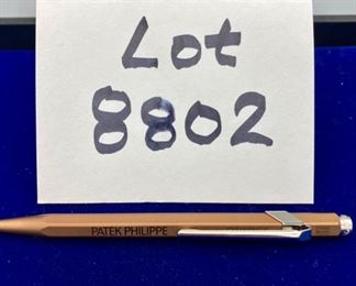 Lot 8802  $80.00 Copper/Bronze Colored Pen wth Patetk Philippe Blue Ink Ball Point Pen by Caran D'Ache. Retails for $150.00 and sold on Ebay for $108.74.  Swiss made precision instrument. 5.5' L