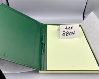 Lot 8804 $250.00 Large Green Leather Rolex Notebook/Portfolio with Original Box and Tissue. The leather is embossed with Rolex Logo, includes: Swiss Made Rolex Pen by Caran D'Ache and Rolex Pad of Paper with Logo. Rare. Suggested Retail is $510.00 	12.5" T x 10" W