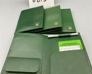 Lot 8813 $225.00 Each (Have 4) New Rare Authentic Rolex 100.25.34 Sea Dweller Wallet with 16600 Divers L Extension Link.  The Classic Rolex Green Wallet, Special Rolex 2 Sided Tool, Decompression and Dive Tables.  Sells for $398.00 + on Ebay and those are pre-owned.