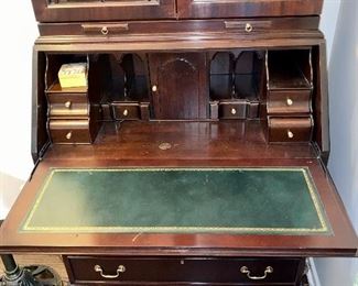 Lot 8754  $895.00  Here is a stunning Jasper Secretary! One Piece Mahogany Secretary and Hutch. Features Glass Shelves, Lit, Secretary has Green Leather top. Dimensions: 87" T x 34" W x 19" D.   If you recognize this piece, it was sold at our sale in Hinsdale this May.  We accepted a return, so we are giving everyone an opportunity to purchase this beautiful piece.