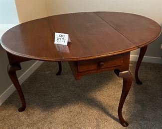 Lot 8771 $375.00  Antique Georgian Mahogany Drop Leaf Table Queen Anne with Hoof Feet and Pull-Out Drawer in Excellent Condition  50.5" L x 41.5" W Oval. Closed 41.5" L x 19.5" W. 
