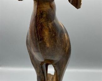 Lot 8815  $150.00  Awesome Hand-Carved Ram out a single piece of wood.  Very heavy and really unique piece.  Great gift for a Dodge Ram Fan and with Father's Day around the corner. Base 8" L x 5" W; Ram 17" T x 13" L