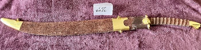 Lot 8826. $95.00 Sword and Sheath.  Leather Grip and Leather Sheath.  Brass Locket and Chape on Sheath.  Brass on Pommel and Cross-Guard. 