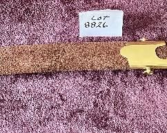 Lot 8826. $95.00 Sword and Sheath.  Leather Grip and Leather Sheath.  Brass Locket and Chape on Sheath.  Brass on Pommel and Cross-Guard. 