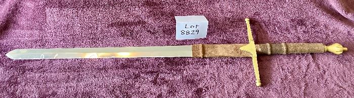 Lot 8829  $95.00  Sword without Scabbard.  Leather/Suede Grip with Brass Cross-Guard and Pommel.  Look like and Knights Sword with Heavy Stainless Steel Blade. How about a little Game Of Thrones Party.  42" Long x 1 1/2 " W Blade. 
