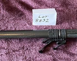 Lot 8832. $95.00. Black Katana Sword and Black Sheath.  Grip is traditional wrapped with a white handle.  Square Cross-Guard.  30" L x  1" W Blade. 
