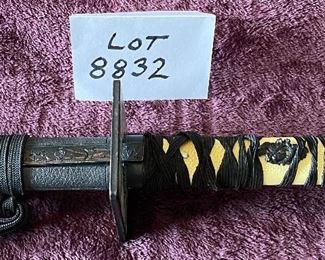 Lot 8832. $95.00. Black Katana Sword and Black Sheath.  Grip is traditional wrapped with a white handle.  Square Cross-Guard.  30" L x 1" W Blade. 
