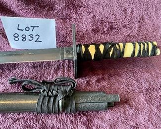 Lot 8832. $95.00. Black Katana Sword and Black Sheath.  Grip is traditional wrapped with a white handle.  Square Cross-Guard.  30" L x 1" W Blade. 