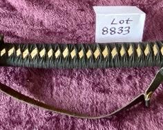 Lot 8833. $105.00 Katana Sword with Sheath. Brass Cross Guard and Pommel on Hilt. Copper guard on Glass.  The Detail on the Grip and Sheath match.