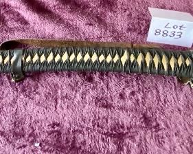 Lot 8833. $105.00 Katana Sword with Sheath. Brass Cross Guard and Pommel on Hilt. Copper guard on Glass.  The Detail on the Grip and Sheath match.