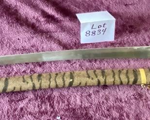 Lot 8834. $50.00  Katana Sword and Sheath.  Replica sword is Stainless Steel but Sheath is Plastic with Tiger Design.