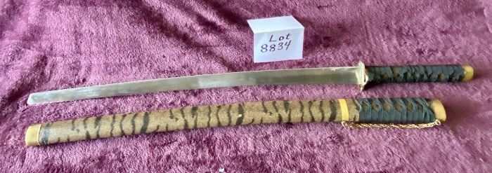 Lot 8834. $50.00  Katana Sword and Sheath.  Replica sword is Stainless Steel but Sheath is Plastic with Tiger Design.