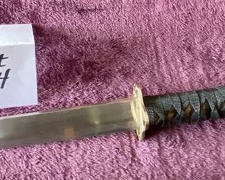 Lot 8834. $50.00  Katana Sword and Sheath.  Replica sword is Stainless Steel but Sheath is Plastic with Tiger Design.