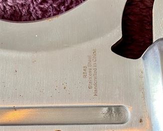 Lot 8836  $48.00. Robert Stiflett Design Knife with Rosewood and Stainless Steel Hilt.  13" L x 2" W Blade.  Comes with Nylon Sheath.  Intimidating Design.