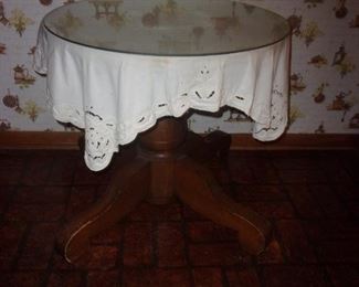 Round wooden table with glass top  $40