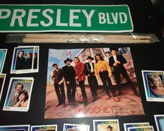 Metal Elvis Presley sign, CMA gold cards, autographed pics