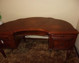 Half around mahogany stain computer desk