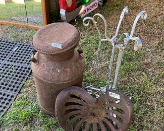 Old milk jug and tractor seat