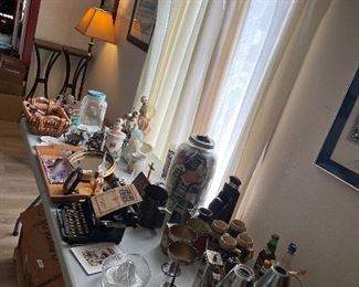 Vintage and Antique Items:  5gal Jar with Eagle, Corona 3 Typewriter, Antique Iron, LSU Decanter and more!