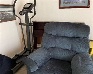 Reclining Chair to relax after using stair stepper..Wood headboard in background