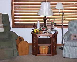 La-Z-Boy recliner, green striped chair, octagonal lamp table, magazine holder, floor lamp